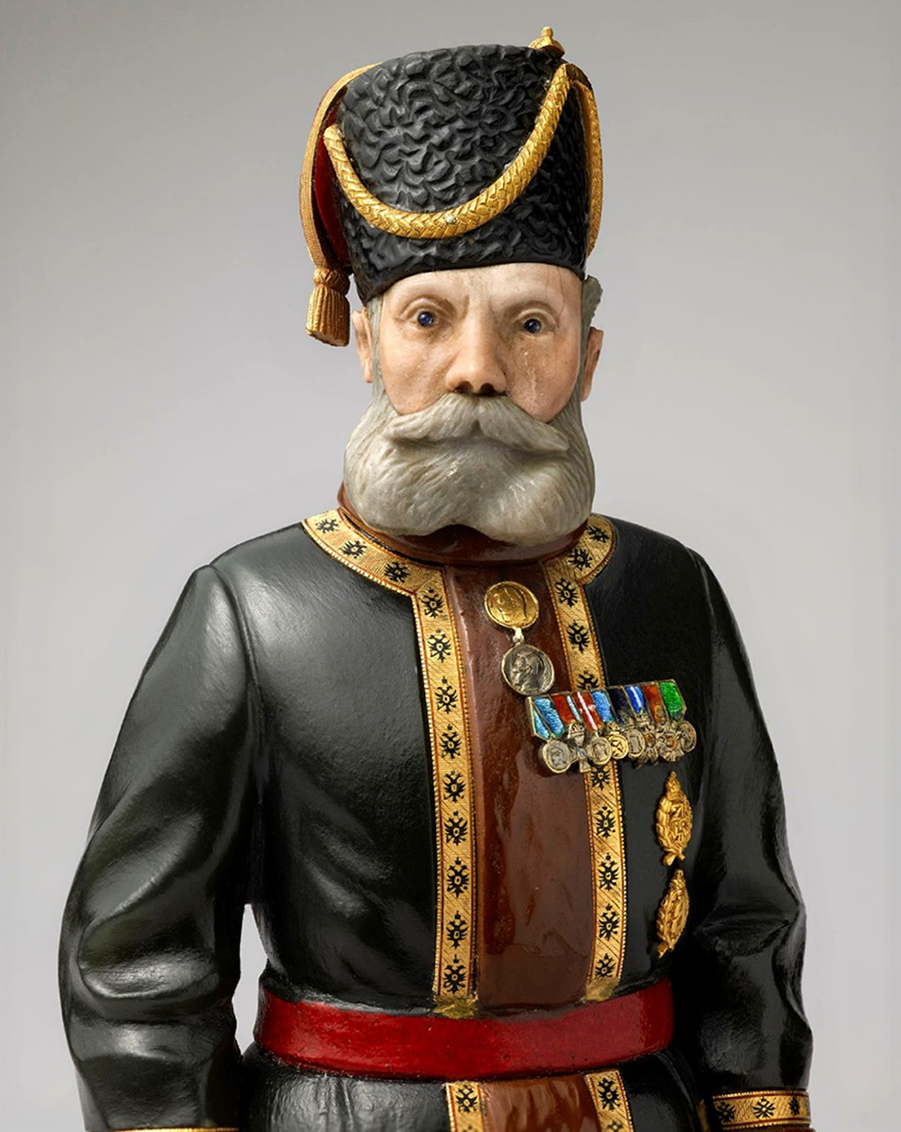 An Imperial hardstone portrait figure by Carl Fabergé, of Kamer-Kazak N. N Pustynnikov